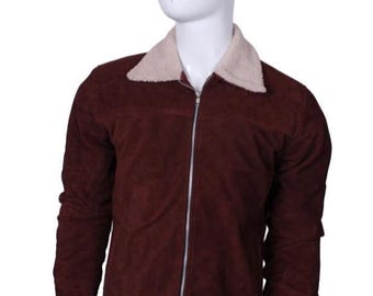 May include: A burgundy suede jacket with a cream-colored, fuzzy collar. The jacket has a silver zipper closure and long sleeves. The jacket is displayed on a white mannequin, showcasing its design and fit.