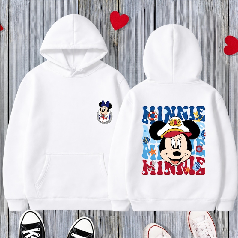 May include: White hooded sweatshirt featuring a Minnie Mouse graphic on the front and back. The front graphic is a small Minnie Mouse emblem. The back graphic features Minnie Mouse in a sailor hat with the name "Minnie" in blue and red.