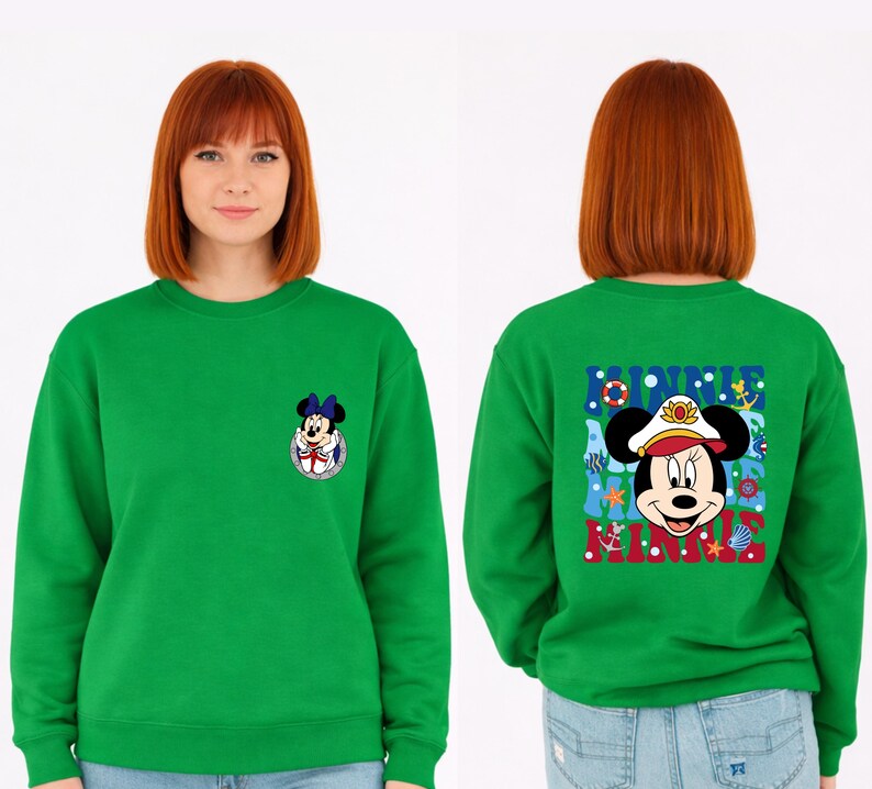 May include: A bright green sweatshirt featuring a Minnie Mouse graphic on the front and back. The front graphic is a small Minnie Mouse in a sailor outfit. The back graphic says "MINNIE" with Minnie Mouse in a sailor hat.