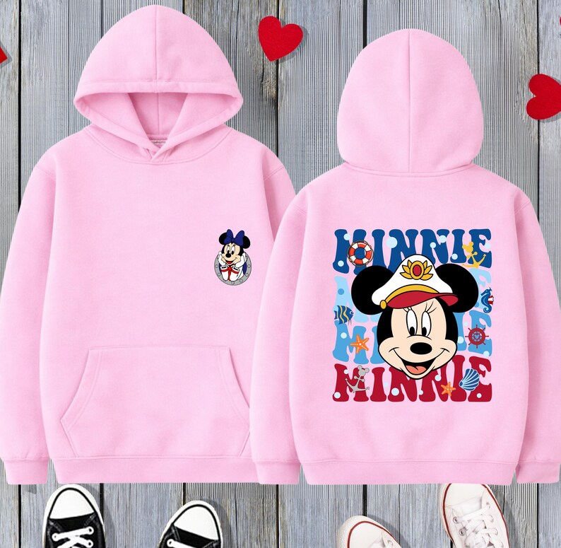 May include: Pink hooded sweatshirt featuring a Minnie Mouse graphic on the front and back. The front has a small Minnie Mouse emblem, while the back displays a larger Minnie Mouse design with the name "Minnie".