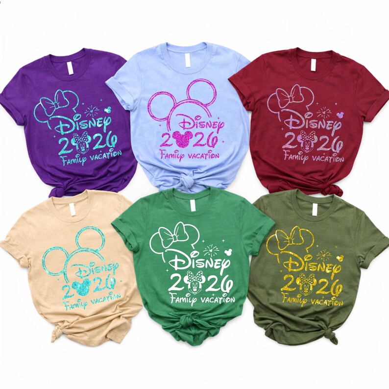 May include: Six short-sleeved t-shirts in various colors, including purple, blue, and green. Each shirt features a Disney-themed design with the text "Disney 2020 Family Vacation" and a Mickey Mouse silhouette.