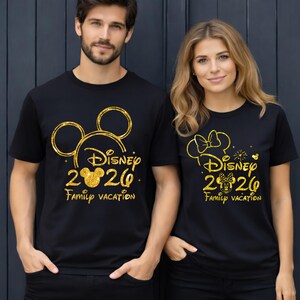 May include: Black t-shirts with gold glitter designs. One shirt features a Mickey Mouse head outline, the text "Disney 2020 Family Vacation". The other shirt has a Minnie Mouse head outline, the text "Disney 2020 Family Vacation".