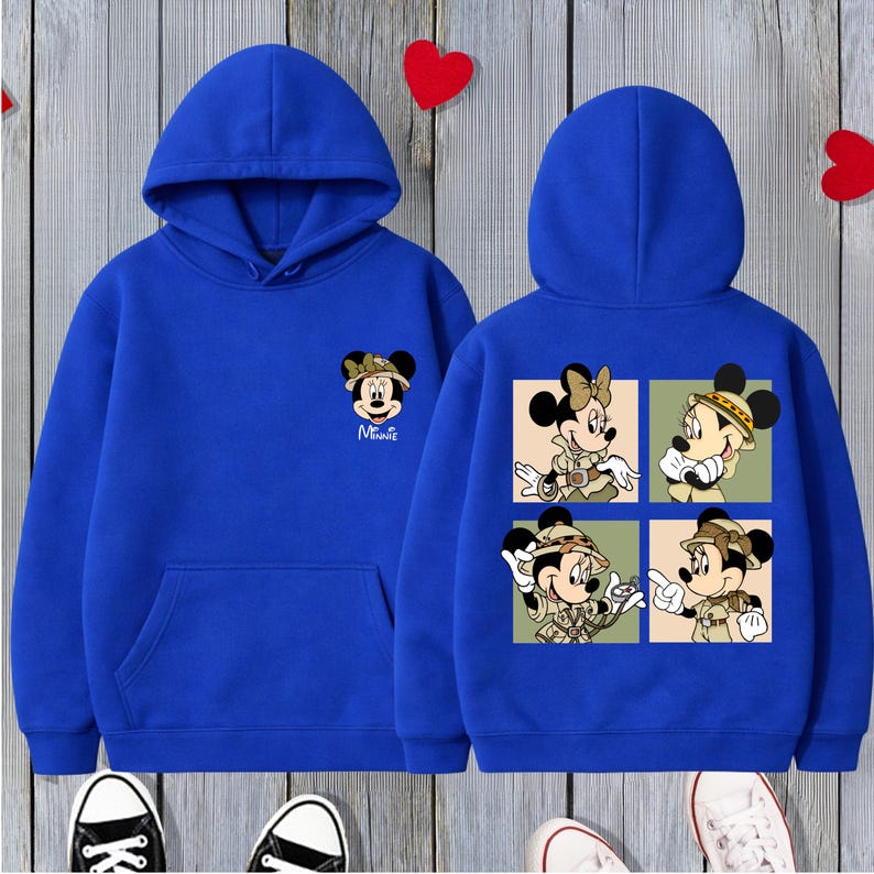 May include: A white ceramic mug with a black handle and the text "But First, Coffee" in a bold, black font. The mug is set against a blurred background, suggesting a cosy setting.