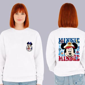 May include: White sweatshirt featuring a Minnie Mouse graphic on the front and back. The front graphic is a small Minnie Mouse in a sailor outfit. The back graphic says "MINNIE" in blue and red with nautical elements.