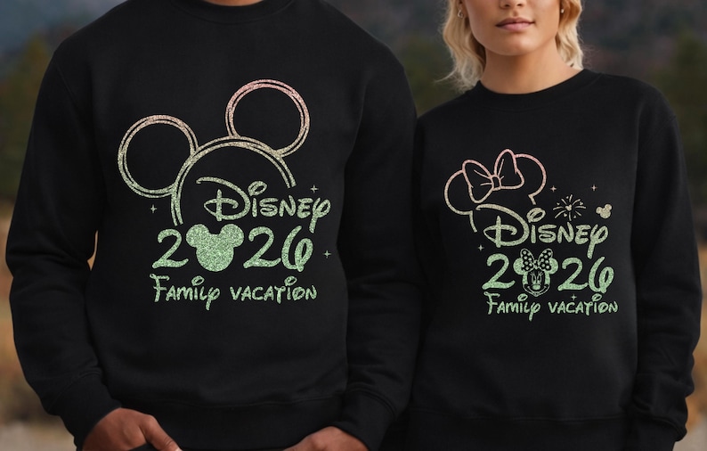 May include: Black sweatshirts with Disney-themed designs. One features Mickey Mouse ears, the text "Disney 2020 Family Vacation" in green glitter. The other has a Minnie Mouse bow and similar text. A fun matching set.