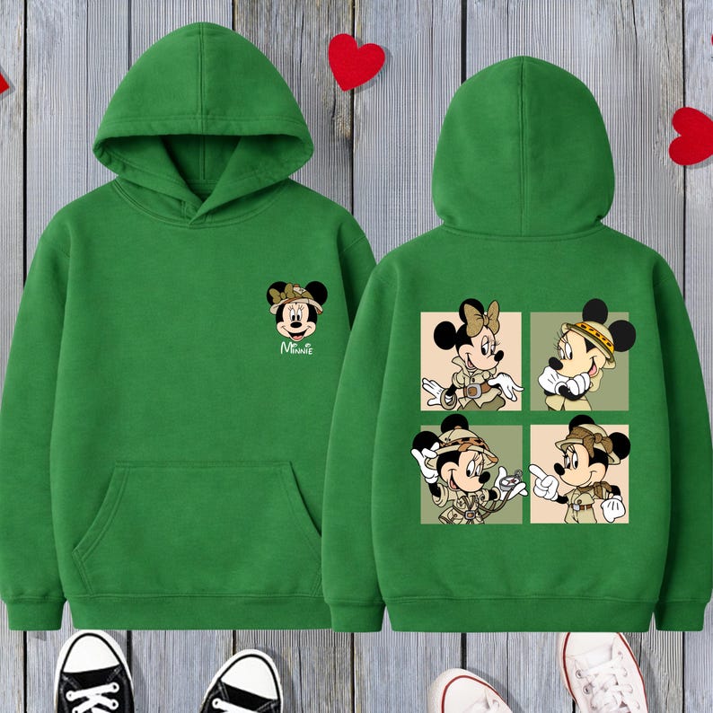 May include: Green hooded sweatshirt with a Minnie Mouse graphic on the front and back. The front shows Minnie's face with the word "Minnie". The back has four panels with Minnie and Mickey Mouse in safari outfits.