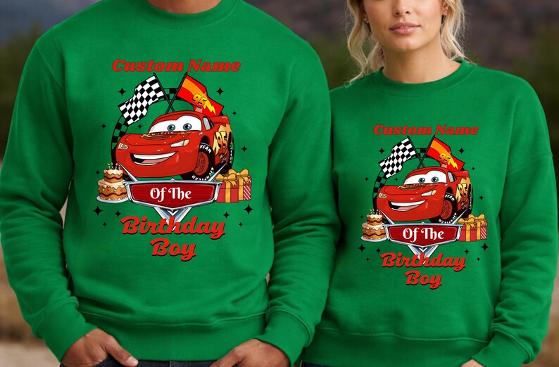 May include: Green sweatshirts with a red Lightning McQueen graphic, checkered flags, and the text "Custom Name" and "Of The Birthday Boy" in red. The design includes a birthday cake and wrapped gifts.
