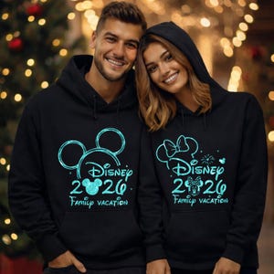 May include: Black hoodies with teal graphics. One hoodie features Mickey Mouse ears, the text "Disney 2020 Family Vacation". The other hoodie has a Minnie Mouse bow, the same text, and fireworks.