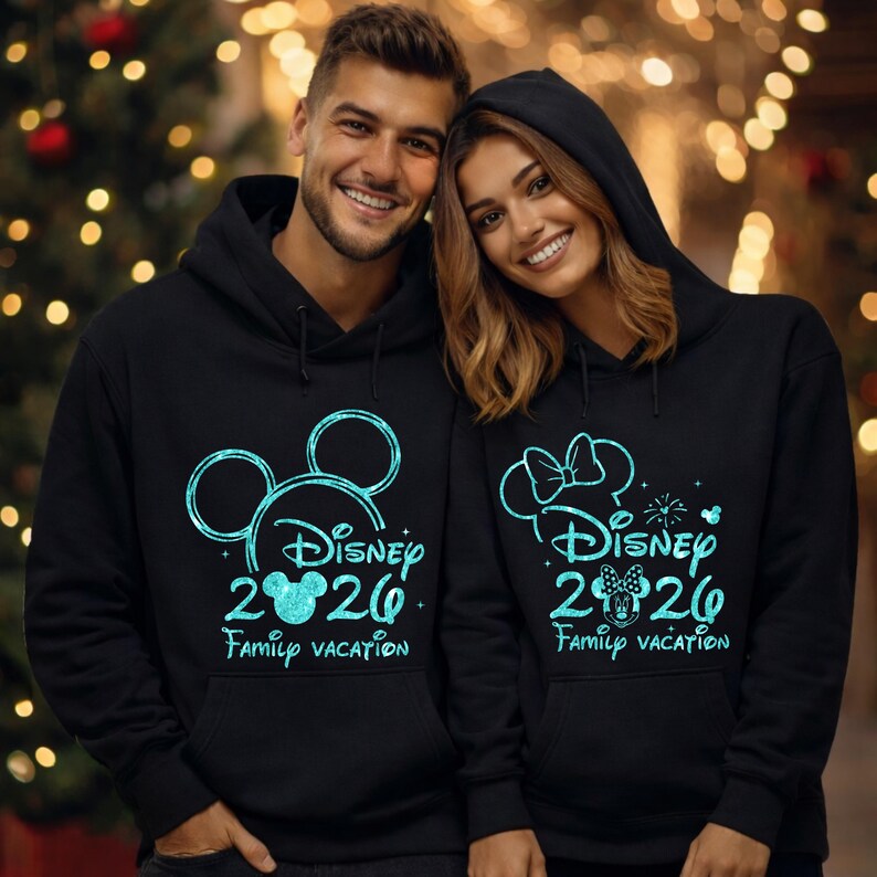 May include: Black hoodies with teal graphics. One hoodie features Mickey Mouse ears, the text "Disney 2020 Family Vacation". The other hoodie has a Minnie Mouse bow, the same text, and fireworks.