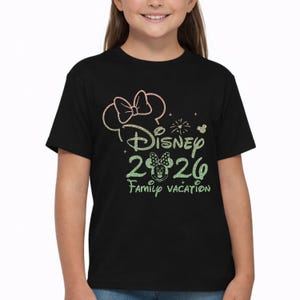 May include: A set of three ceramic mugs with a speckled, matte finish. The mugs are in shades of cream, light gray, and dark gray. Each mug has a simple, minimalist design and a rounded handle.