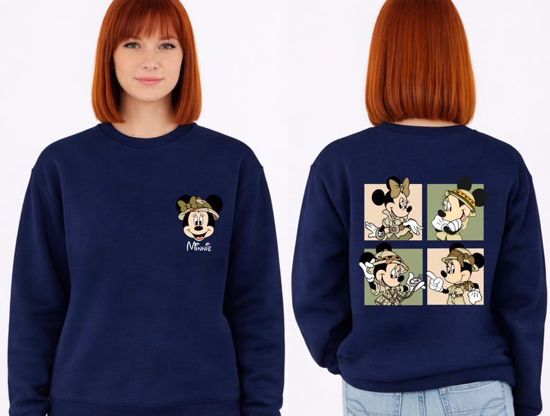 May include: A navy blue sweatshirt with Minnie Mouse in safari gear. The front has a small Minnie graphic with the name "Minnie" in white. The back features a four-panel design of Minnie and Mickey in safari outfits.