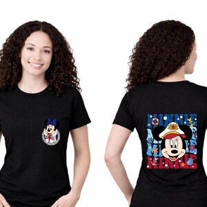 May include: Black t-shirt featuring a Minnie Mouse graphic on the front and back. The front graphic is a small Minnie Mouse in a sailor outfit. The back graphic says "MINNIE" with Minnie Mouse wearing a sailor hat.