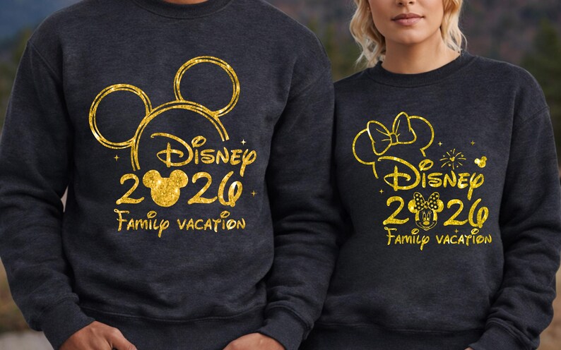 May include: Two dark gray sweatshirts with gold glitter designs. One features a Mickey Mouse head outline, the text "Disney 2020 Family Vacation". The other has a Minnie Mouse head outline, the same text, and a bow.