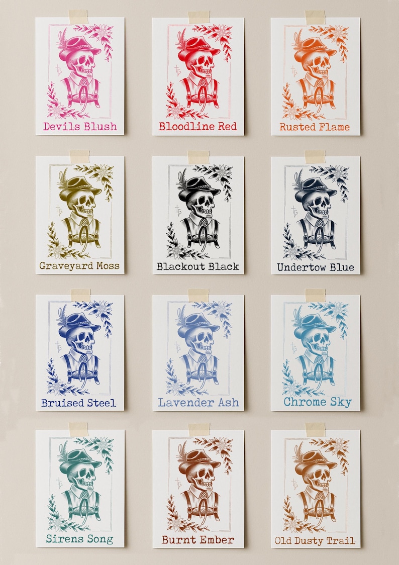 Puede incluir: Una colecci&oacute;n de doce grabados art&iacute;sticos, cada uno con una calavera estilizada con sombrero y tirantes, con detalles florales. Cada grabado tiene una combinaci&oacute;n de colores y un nombre &uacute;nicos, como "Devils Blush" y "Bloodline Red".