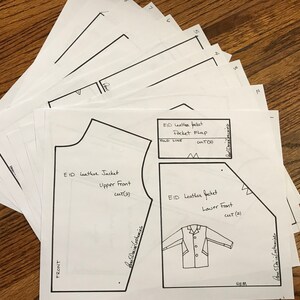 May include: A black and white sewing pattern for a leather jacket. The pattern includes pieces for the upper front, lower front, and pocket flap. The pattern is labeled "EID Leather Jacket".