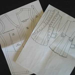 May include: Two white paper sewing patterns with black outlines. One pattern shows a vest front and back, labeled "PanSD's Miniature Costuming." The other pattern shows a coat with button details and pockets. The text "cut 2" is visible.