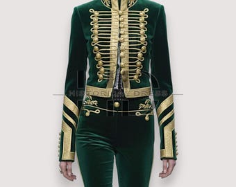 May include: A dark green velvet jacket with gold trim and buttons. The jacket has a high collar and decorative gold embellishments. The matching pants are also dark green. The text "HISTORICAL DRESS" is at the bottom of the image.