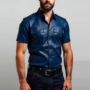 May include: A short-sleeved, navy blue leather shirt with two chest pockets and a button-down front. The shirt is paired with dark blue jeans and a black belt.