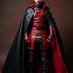 May include: A red and black leather costume with a long black cape. The costume features a red jacket with black buttons and a black belt. The outfit includes matching red leather pants and black boots. The image includes the text "Leather Nirvana".
