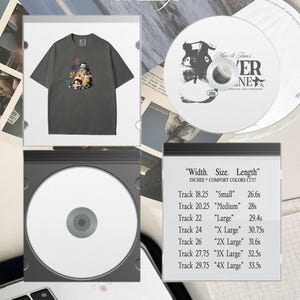 Peut inclure: T-shirt gris fonc&eacute; avec un graphisme color&eacute; de personnages de dessins anim&eacute;s. Un CD avec le texte "Mars & Jean's" et "VER NE" est visible. L'image comprend &eacute;galement une liste des tailles et longueurs des pistes en pouces.