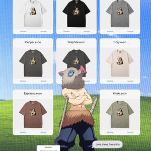 Peut inclure: Plusieurs t-shirts de couleurs vari&eacute;es, dont blanc, noir, gris, poivre, graphite, ivoire, expresso et kaki. Chaque t-shirt pr&eacute;sente un motif graphique et le texte "White.evcn", "Black.evcn", "Grey.evcn", "Pepper.evcn", "Graphite.evcn", "Ivory.evcn", "Espresso.evcn", et "Khaki.evcn".