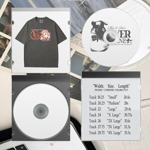 May include: A dark gray t-shirt with a graphic design and the text "Get Your Heart Racing". A CD with a black and white design and the text "Mars & Jean's" and "VER NE". A black CD case with a white CD inside. Text on the image: "dream on little dreamer".