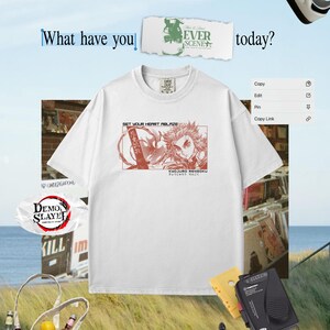 May include: White t-shirt featuring a red graphic of a character with the text "SET YOUR HEART ABLAZE" and Japanese text. The image includes a cassette player, headphones, and a tote bag with text. The background is a light blue sky.