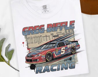 May include: White t-shirt featuring a graphic of a red and blue race car with the text "GREG BIFFLE RACING". The design includes a toolbox background and the number 5 on the car.