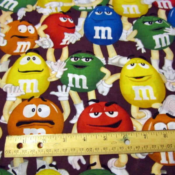 M&M Funfetti Packed Fabric on Brown Background by Springs Creative BTY