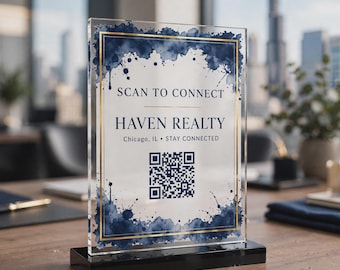 May include: A rectangular clear acrylic sign with a black base featuring a navy blue watercolor border and gold lines. The text reads SCAN TO CONNECT, HAVEN REALTY, Chicago, IL, STAY CONNECTED, and includes a central black and white QR code.