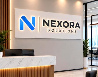 May include: A large rectangular wall sign featuring the text NEXORA SOLUTIONS in black lettering next to a blue letter N logo. The sign is mounted on a light gray wall above a reception desk with a white marble top and vertical wood paneling.