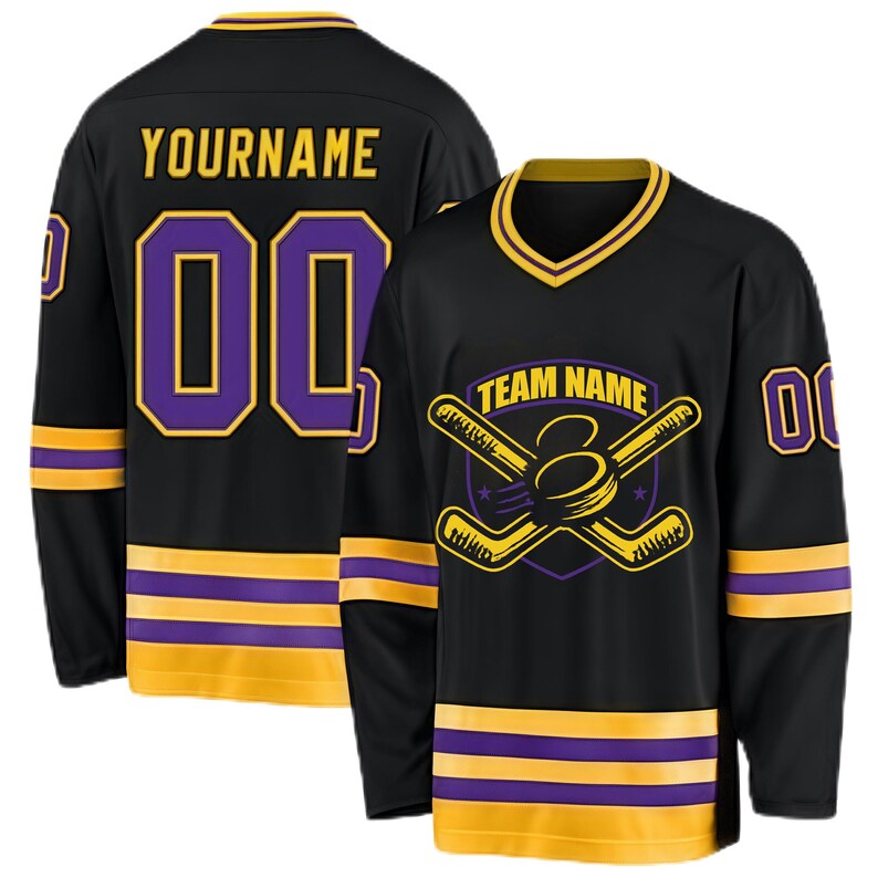 May include: Black hockey jersey with gold and purple accents. The jersey features the text "YOURNAME" and the number "00" on the back. The front displays a hockey-themed logo with the words "TEAM NAME".