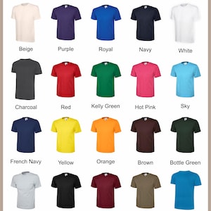 May include: A display of various colored t-shirts, including beige, purple, royal blue, navy, and white. Additional colors are charcoal, red, Kelly green, hot pink, and sky blue. The image also shows French navy, yellow, orange, brown, and bottle green t-shirts. The text "Available Colours" is at the top.