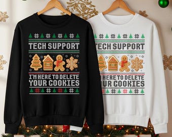 May include: Black and white sweatshirts with a Christmas-themed design. The text "TECH SUPPORT" and "I'M HERE TO DELETE YOUR COOKIES" are displayed. The design includes gingerbread men, houses, snowflakes, and Christmas trees.