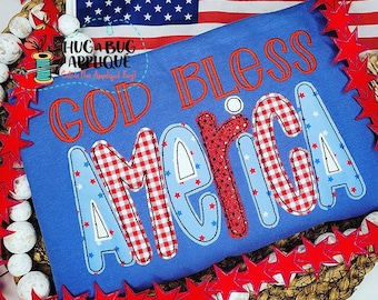 May include: A blue shirt with the words "GOD BLESS AMERICA" in red and white, with a red, white, and blue star-spangled design. An American flag is in the background, along with red star decorations.