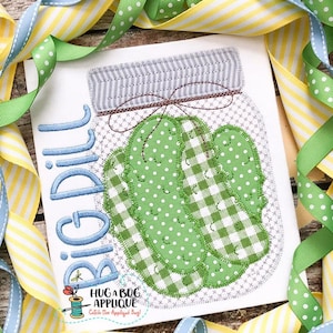 May include: A green and white gingham and polka dot pickle in a mason jar with a blue embroidered text that says "Big Dill".