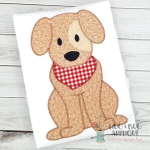 May include: A tan applique of a seated dog with a red and white checkered bandana. The dog has a white patch over one eye and black eyes and nose. The image is on a white background with the text "HUG A BUG APPLIQUE" and "Catch The Applique Bug!"