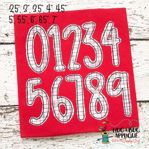 May include: Red felt applique design with numbers 0-9 in a white and black plaid pattern. The numbers are outlined in black and are approximately 2.5 inches tall. The design is perfect for adding a personalized touch to any project.