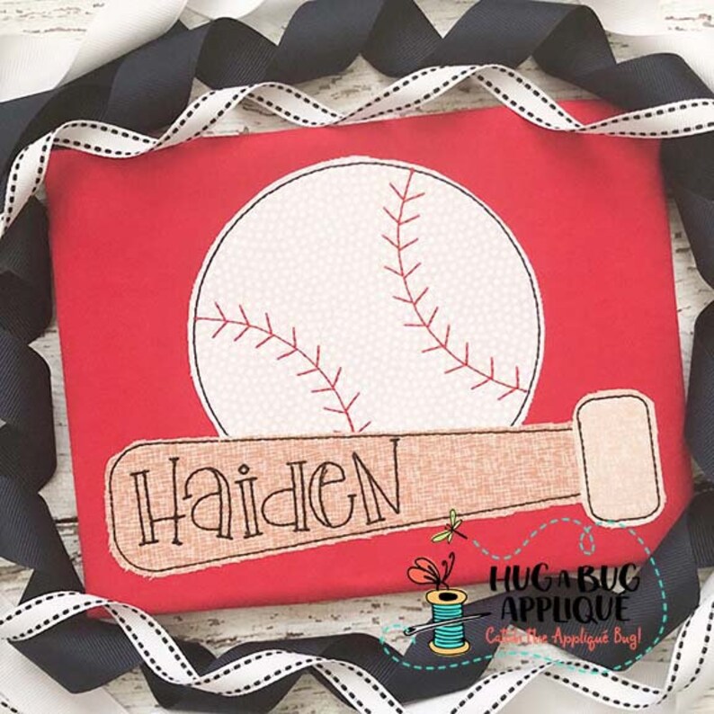 May include: A red fabric with a white baseball and a brown baseball bat with the name "Haiden" embroidered on it. The fabric is surrounded by black and white ribbon.