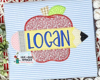 May include: A blue and white striped shirt with an applique of a red apple with a yellow pencil and the name "Logan" on it. The apple has a green leaf and a brown stem.