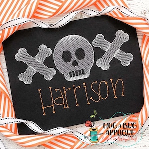 May include: Embroidered design featuring a white skull and crossbones with the name Harrison in orange thread on a black fabric background.
