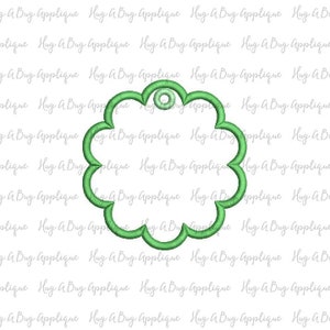 May include: A green, flower-shaped tag with a hole at the top. The tag is blank and ready to be personalized.