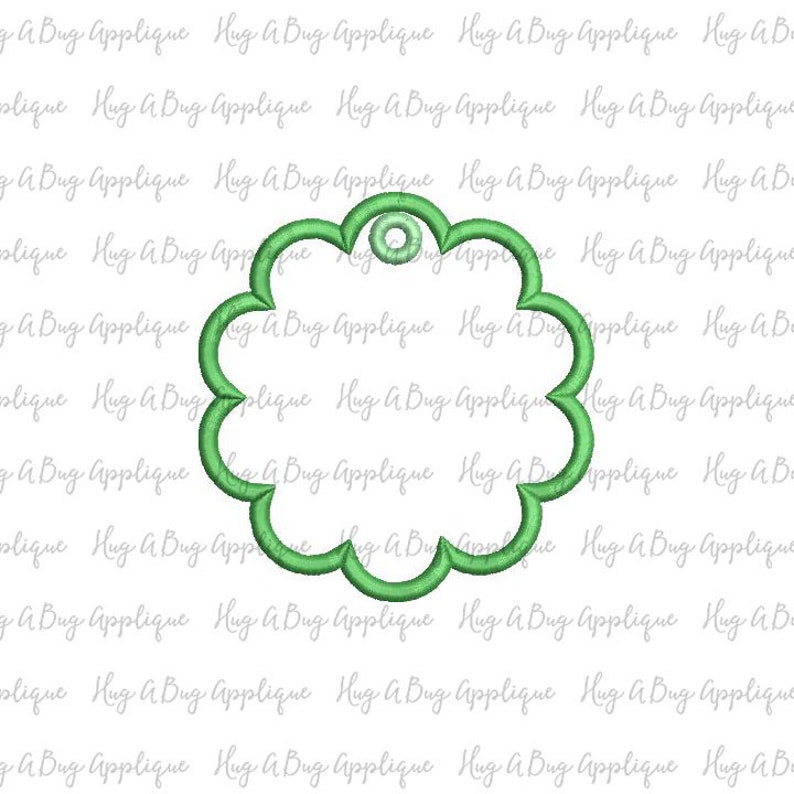 May include: A green, flower-shaped tag with a hole at the top. The tag is blank and ready to be personalized.