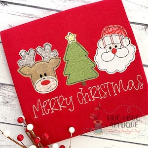 Peut inclure: Appliqué de Noël rouge avec un renne, un sapin de Noël et le Père Noël. Le texte "Joyeux Noël" est cousu sous le motif.