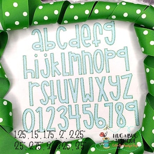 May include: A white background displays a light blue stitched alphabet and numbers, with size measurements below. The image is framed by green ribbon with white polka dots. The text includes the words "HUG A BUG APPLIQUE".