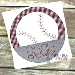 May include: A white baseball with red stitching and a burgundy and white gingham border. The bottom half of the baseball is grey with the name Beau stitched in red.