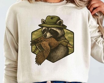 Raccoon Hunting PNG | Raccoon with Duck SVG | Hunting Sublimation Design | Wildlife Animal Clipart | Hunter T-Shirt Graphic