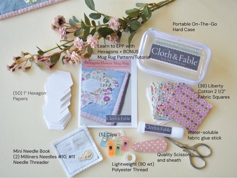 May include: A craft kit with various sewing supplies, including fabric squares, hexagon papers, a needle book, scissors, and a glue stick. The kit also includes a pattern and tutorial for a hexagon flower mug rug. The kit includes a portable hard case.