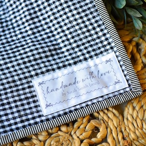 Personalized handmade with love sewing label on black gingham fabric