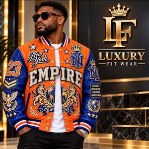 May include: An orange and blue varsity jacket featuring the text EMPIRE, New York, and NY, with embroidered lion, globe, eagle, and crown motifs. The jacket includes gold-tone buttons, striped ribbed cuffs, and the text LOYALTY DISCIPLINE SUCCESS WORLDWIDE.